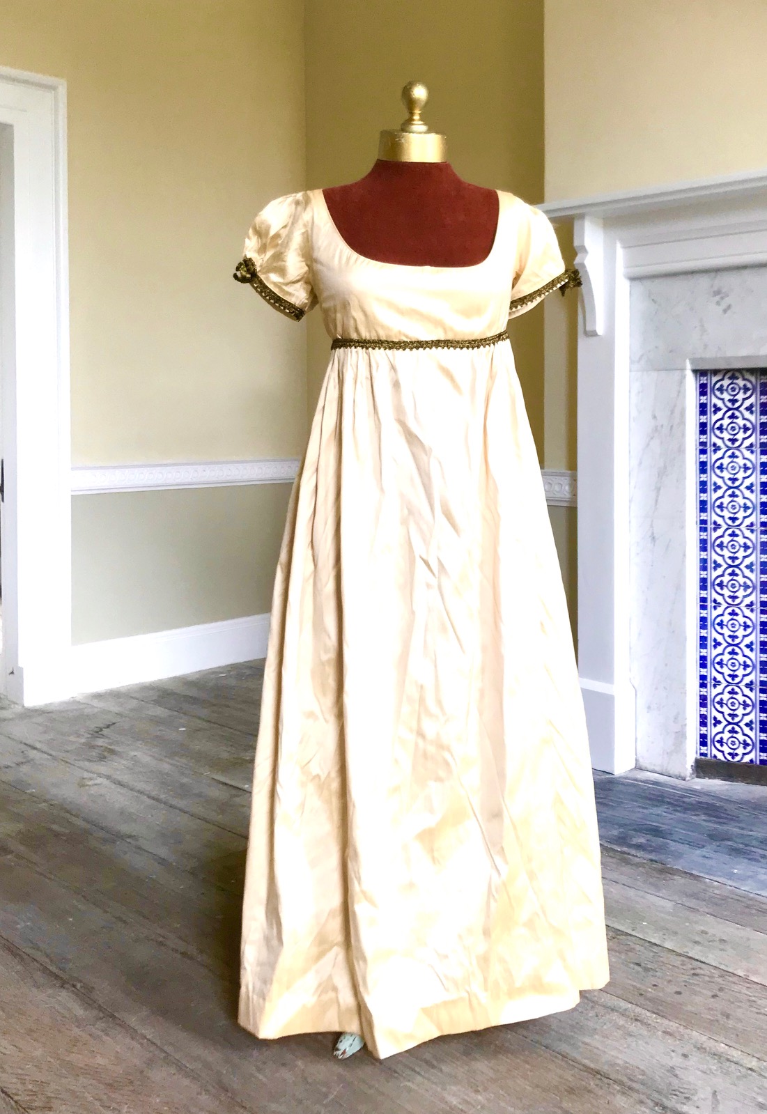 A lady's Regency style day dress in cream silk with black lace trim (lacing at back). Ex London Festival Opera 'Cosi fan tutte'